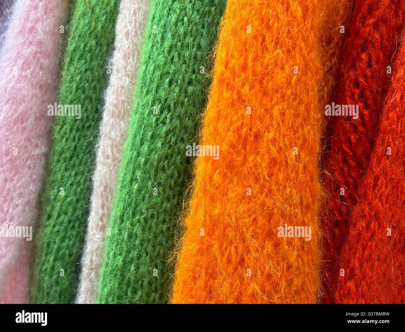 Knitted warm sweaters colorful clothes Stock Photo
