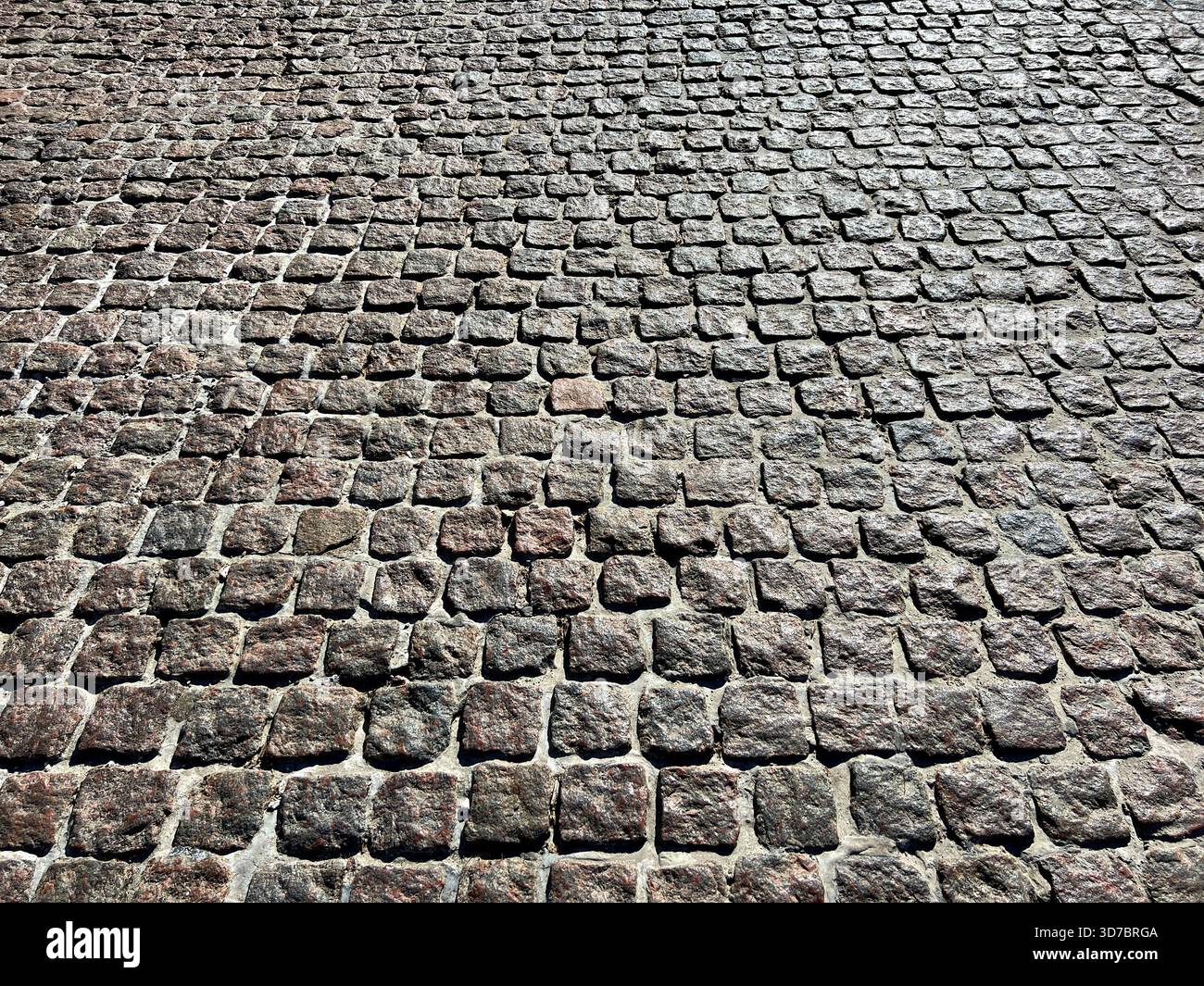 Pavement stone block paving tiles background Stock Photo