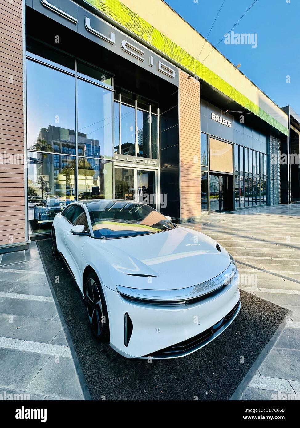 white Lucid Car outside showroom Dubai - Smartphone Captured Stock Image