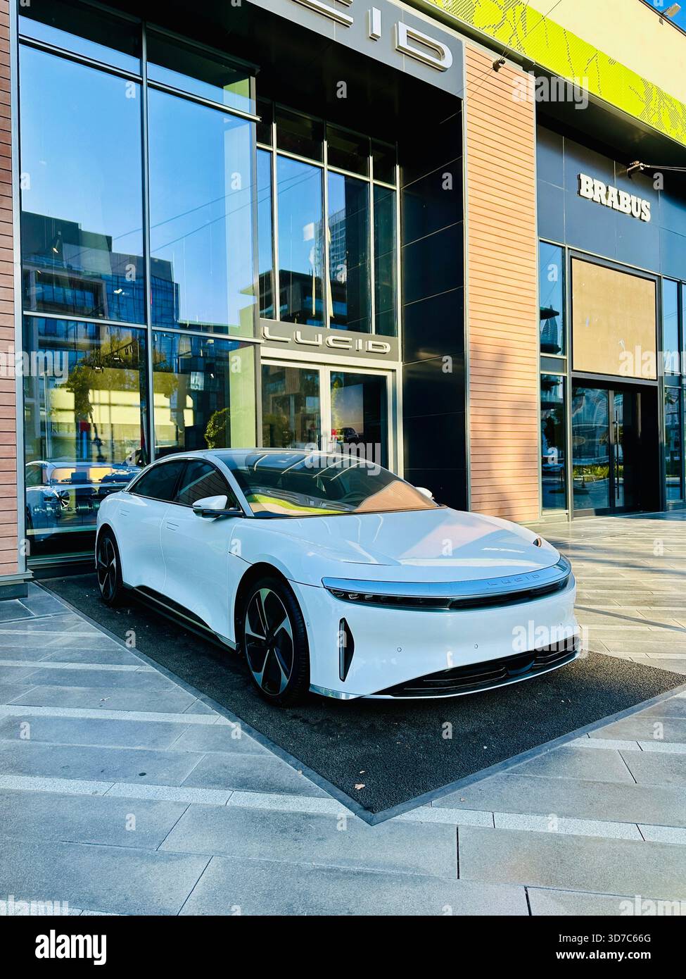 white Lucid Car outside showroom Dubai - Smartphone Captured Stock Image
