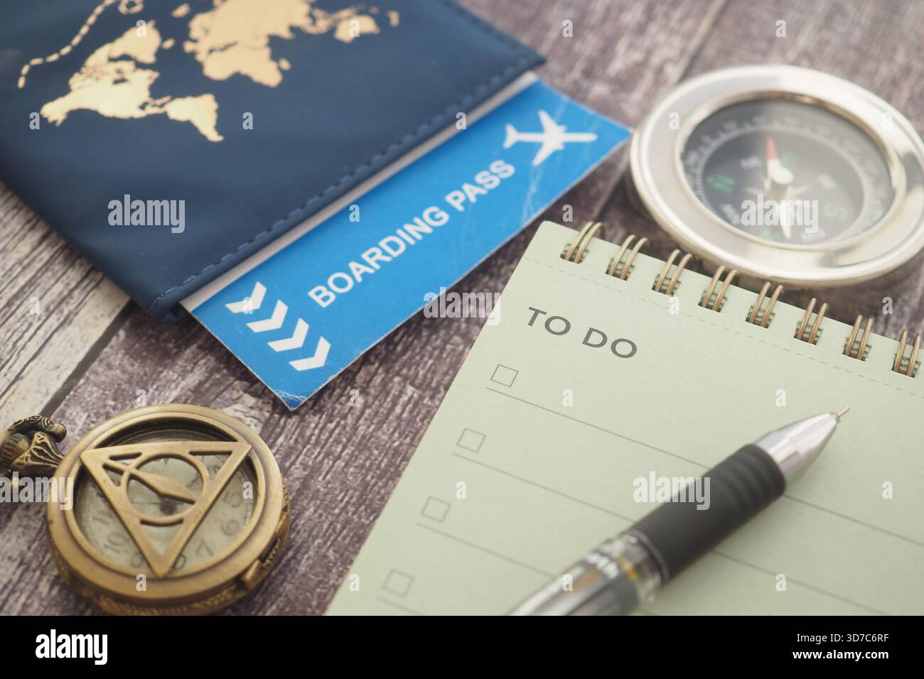 Compass Pass Planning travel with a passport, boarding pass, and compass Stock Photo ...