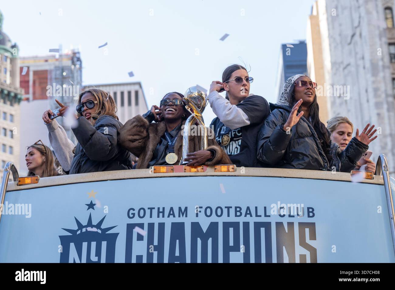 Mandy Freeman Mandy Freeman with trophy rides with teammates on double decker bus ...