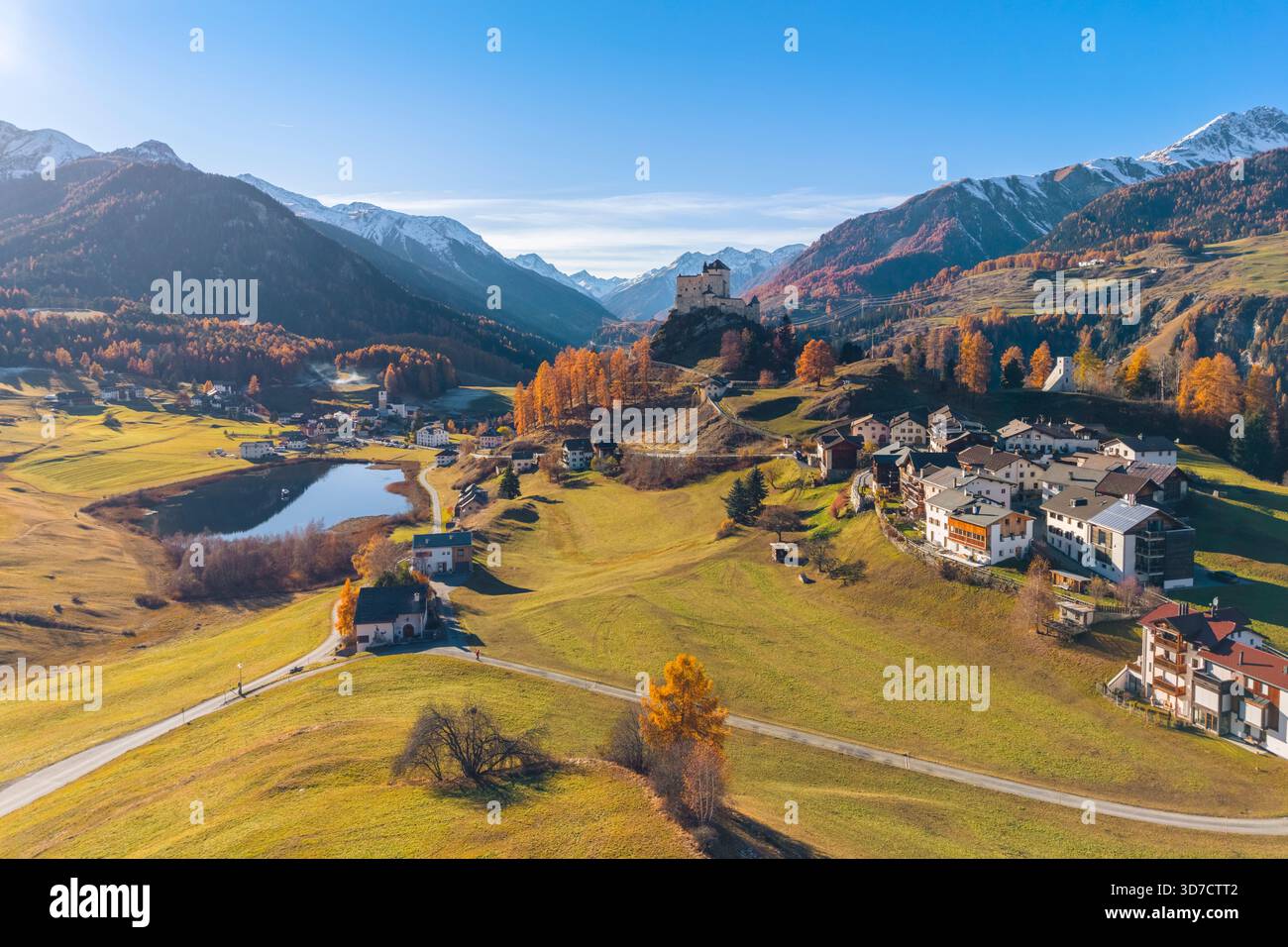 Aerial view of Tarasp castle in autumn. Tarasp, Lower Engadine, Canton of Grisons, Switzerland, Europe. Stock Photo