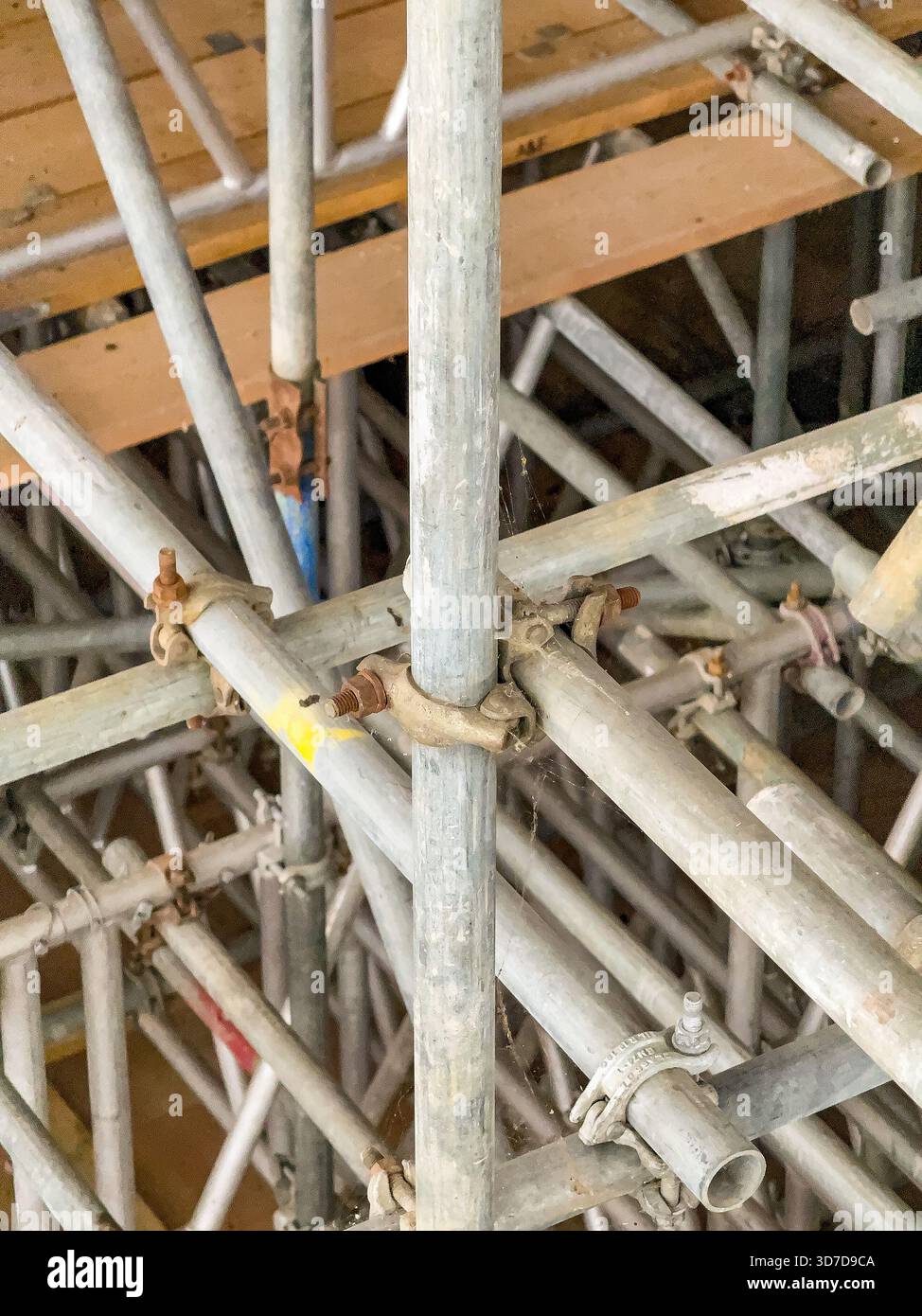Network of scaffolding poles inside a building for refurbishment of the structure. No people. - Smartphone Captured Stock Image