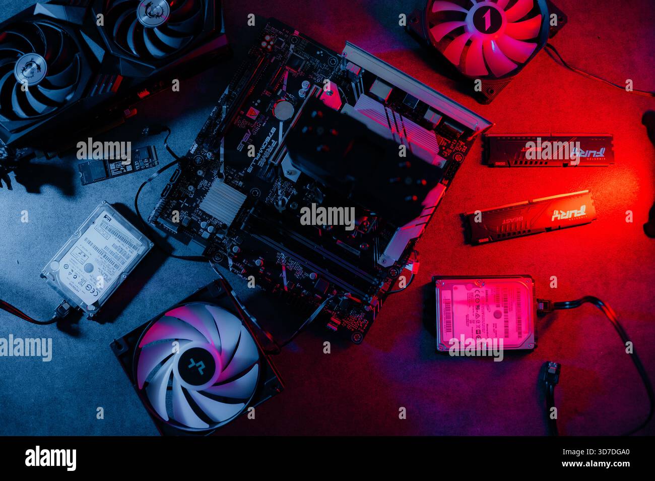 Graphics card and other computer hardware on grey textured table, flat lay. Space for text. Stock Photo