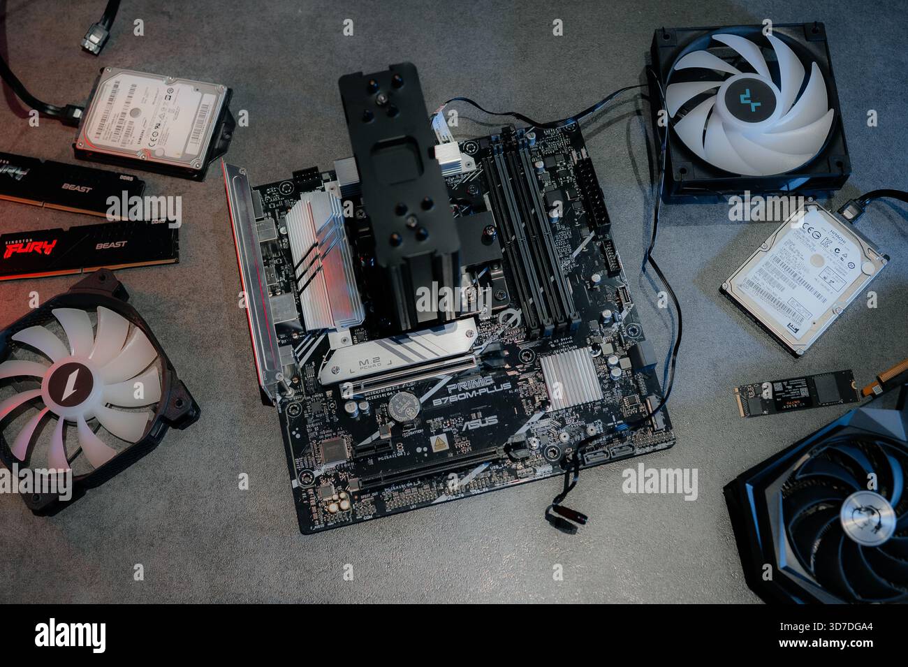 Graphics card and other computer hardware on grey textured table, flat lay. Space for text. Stock Photo