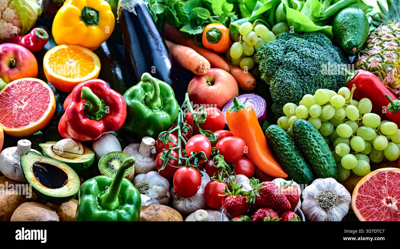 Variety of raw vegetables and fruits. Vegetarian diet. Stock Photo