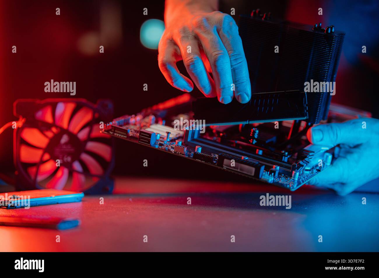 Man assembles a computer system unit at home Stock Photo