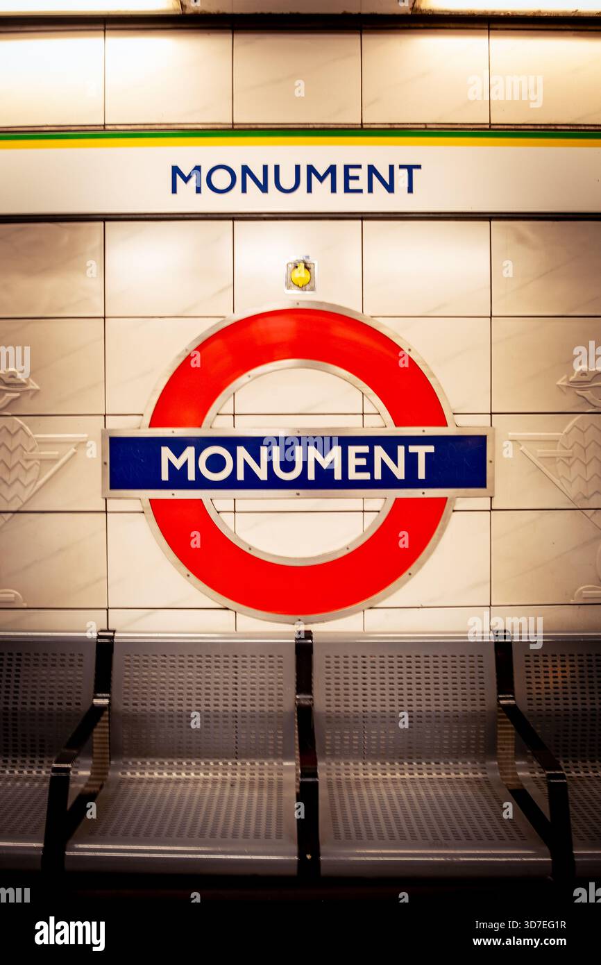 LONDON - OCTOBER 29, 2025: MonumentUnderground Station – District & Circle Line platform with classic roundel Stock Photo