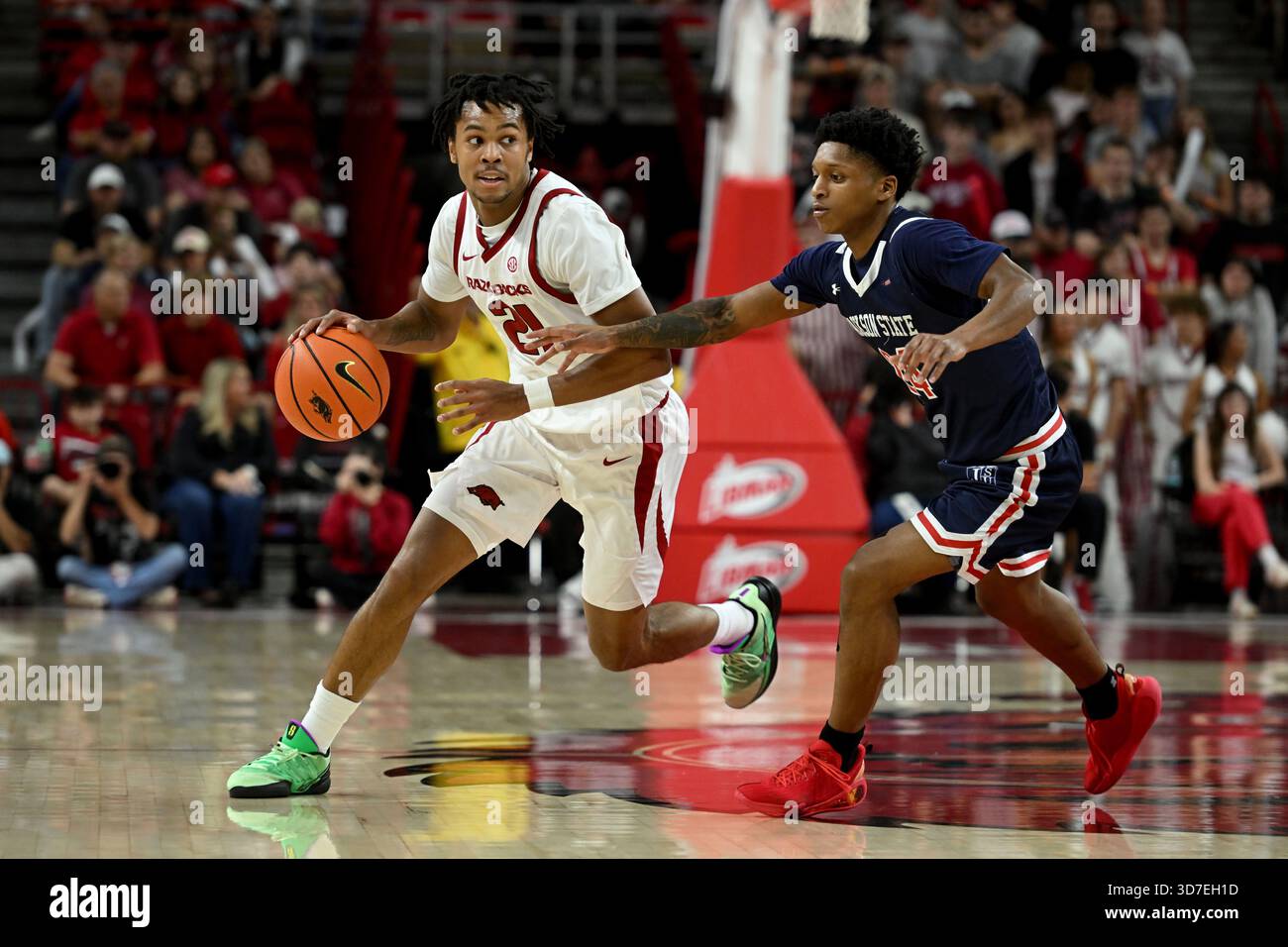 Arkansas guard D.J. Wagner (21) drives past Jackson State guard Daeshun ...