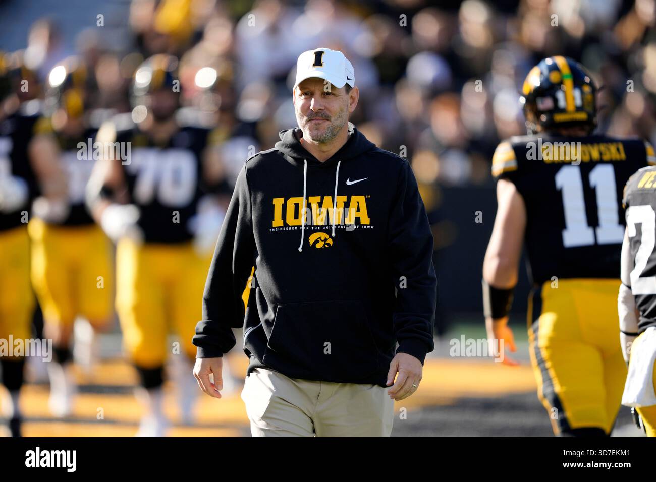 Iowa offensive coordinator Tim Lester stands on the field before an ...