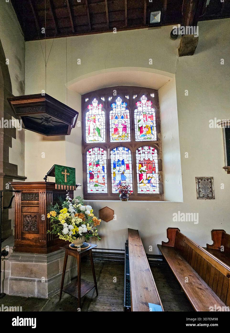 nterior of Holy Trinity Church, Ashford-in-the-Water, Peak District, Derbyshire. Haworth Window dates from 1880. It shows the Six Works of Mercy from - Smartphone Captured Stock Image
