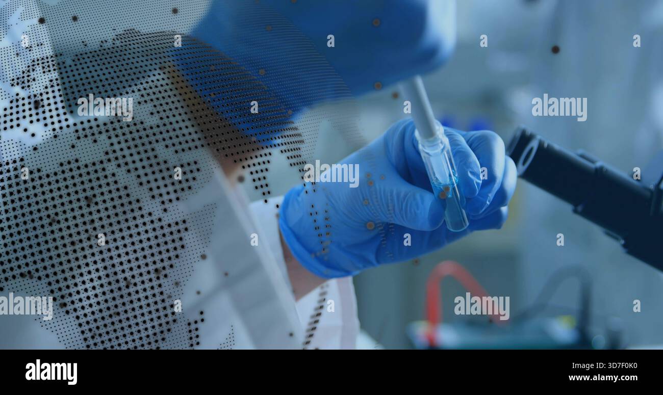Using pipette, researcher in PPE transferring into vial at bench, microscope arm and map overlay Stock Photo
