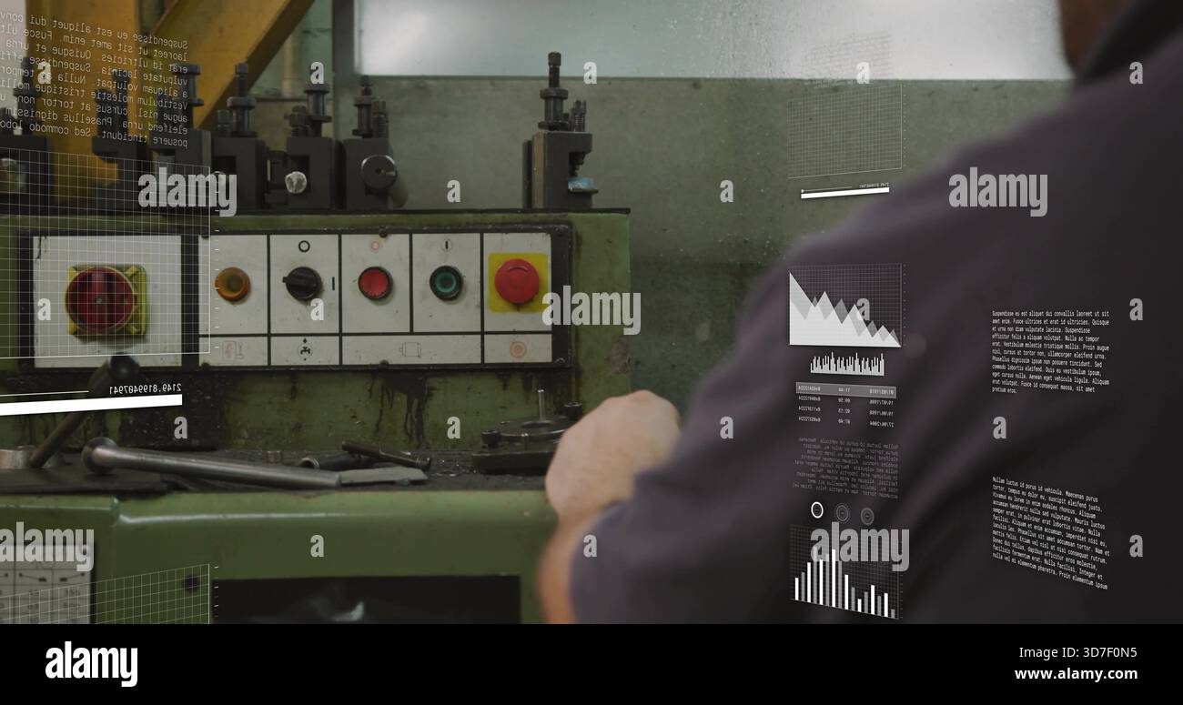 Reaching man using green machine controls in shop, in dark work shirt, red E-stop, copy space Stock Photo
