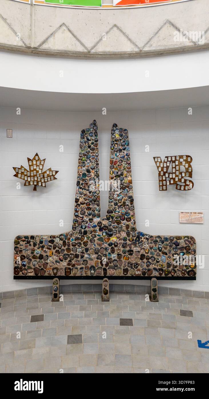 Canadian tribute installation with Twin Towers silhouette, maple leaf, and “VRPS” acronym in tiled mosaic. Vimy Ridge Public - Smartphone Captured Stock Image