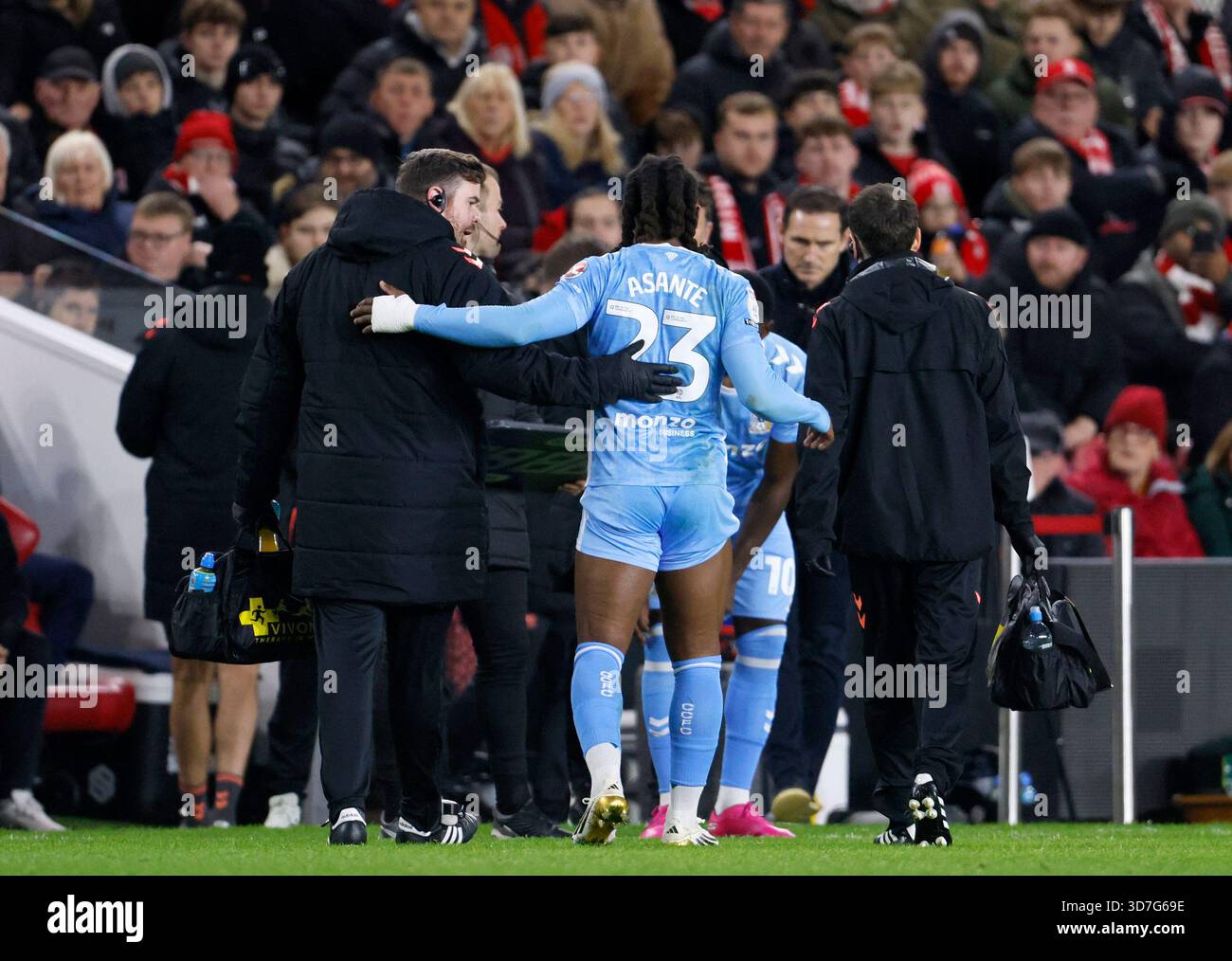 Coventry City's Brandon Thomas-Asante (centre) leaves the pitch with an ...