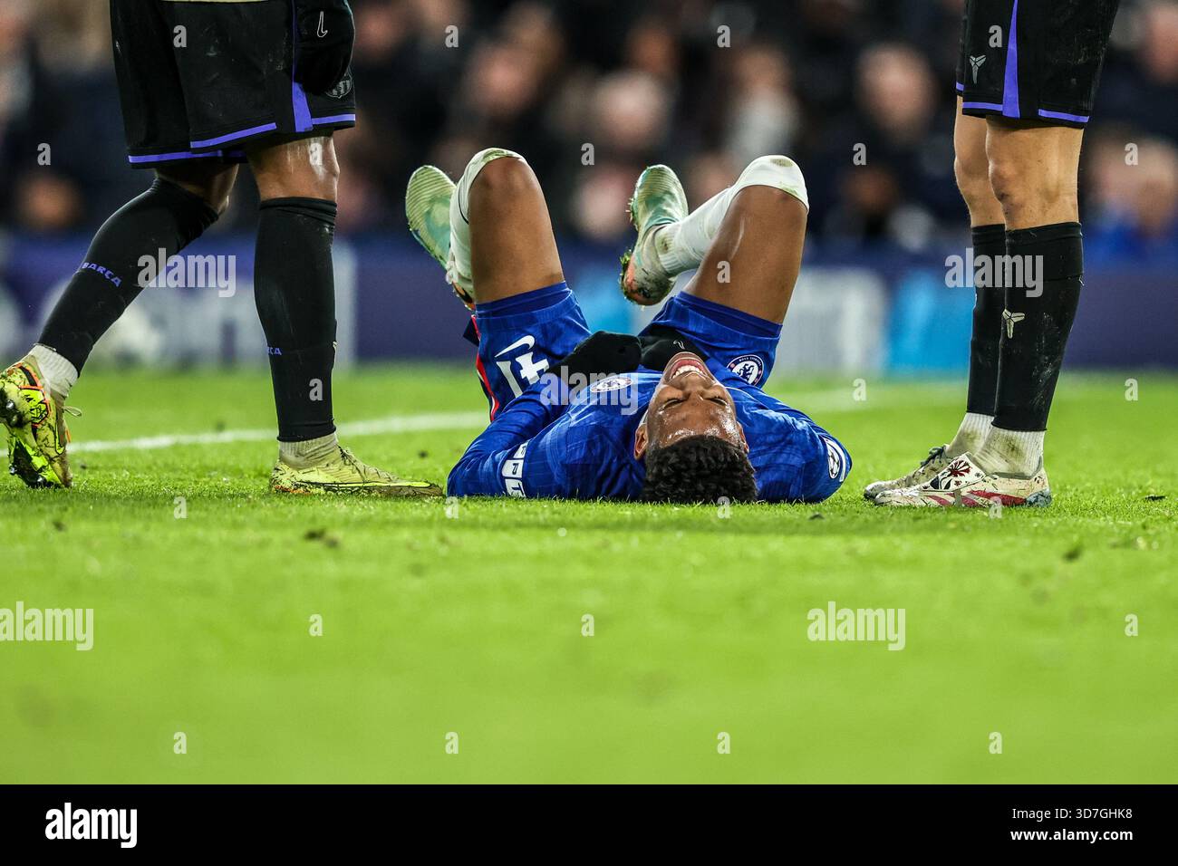 Estêvão of Chelsea goes down injured during the UEFA Champions League ...