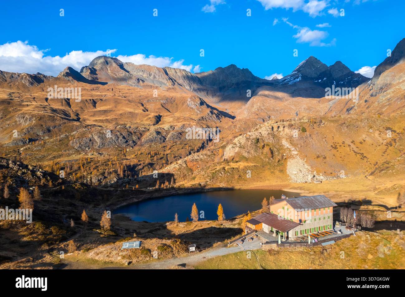 Aerial view of the Rifugio Calvi and Rotondo lake at sunset in autumn. Carona, Val Brembana, Alpi Orobie, Bergamo, Bergamo Province, Lombardy, Italy, Stock Photo