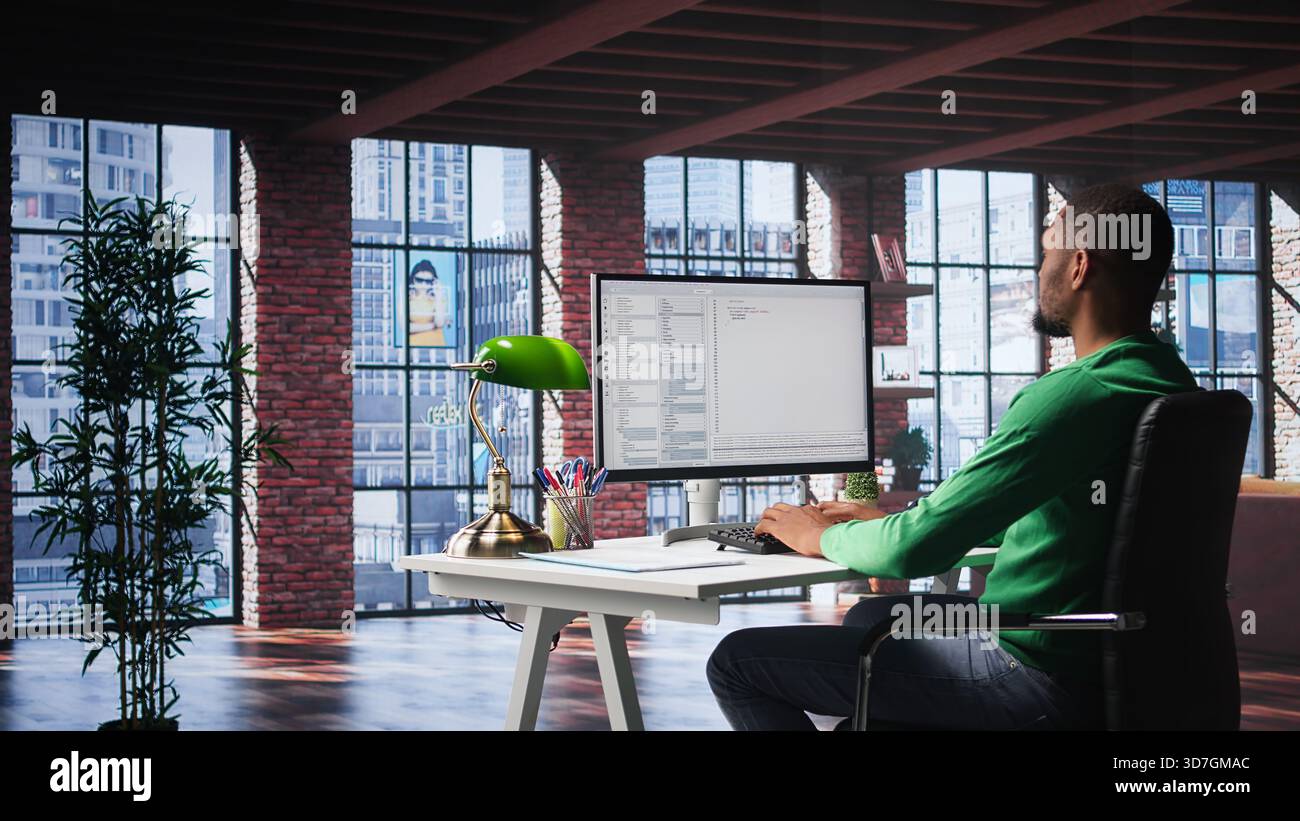 African American IT expert working with a computer full of code. Professional system engineer focuses on software development, debugging, encryption and system security at home. Camera B. Stock Photo