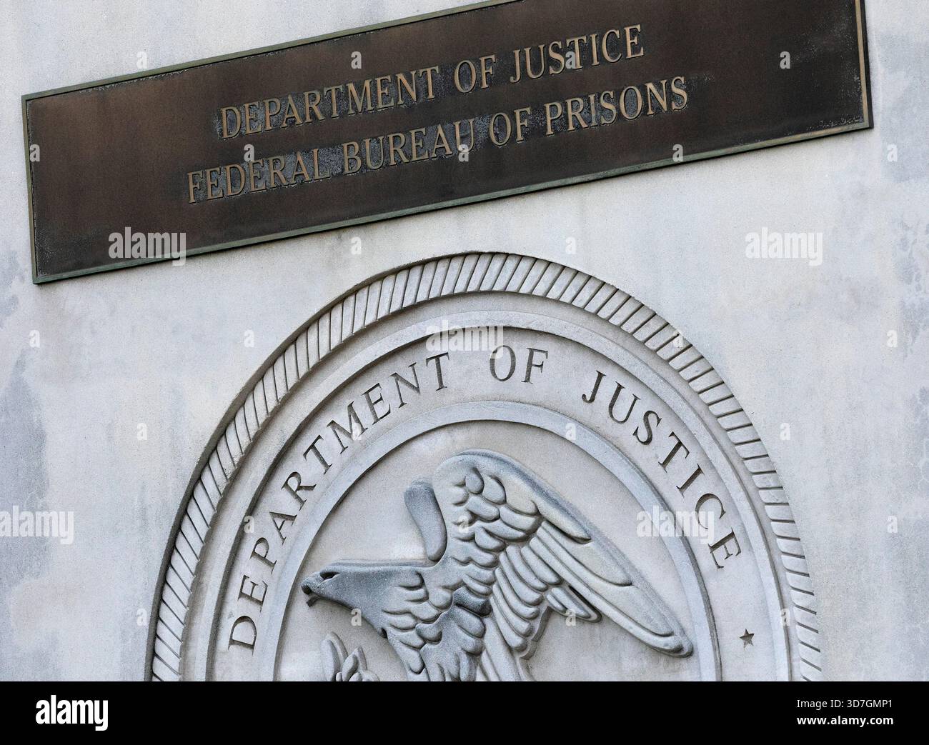 FILE - A sign for the Department of Justice Federal Bureau of Prisons