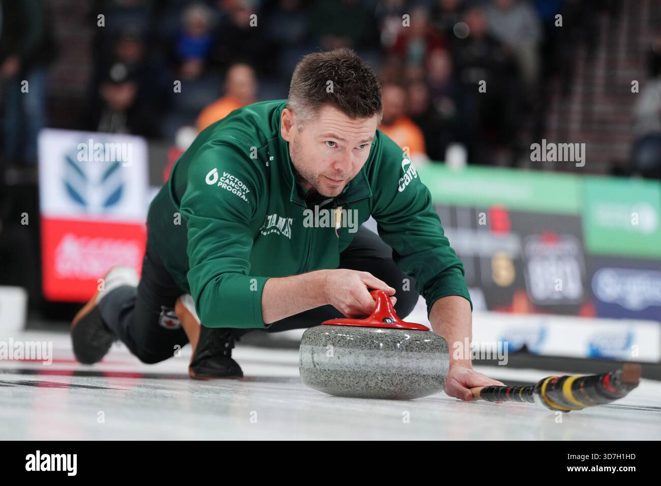 Mike McEwen throws a rock during Canadian Olympic curling trials action ...