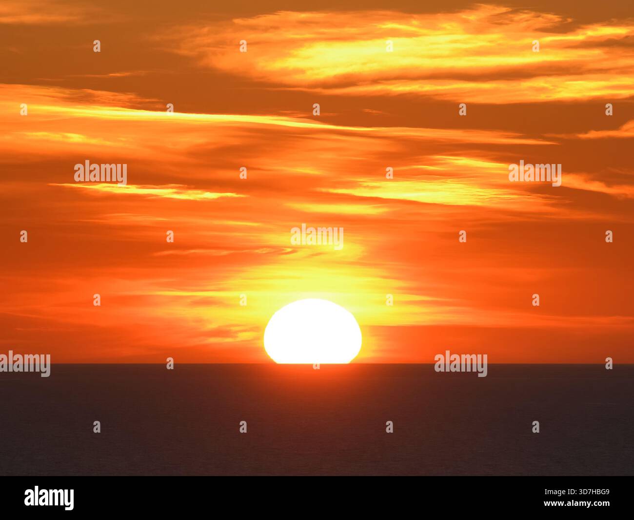 Sunset with orange sky over the Tyrrhenian Sea. Stock Photo
