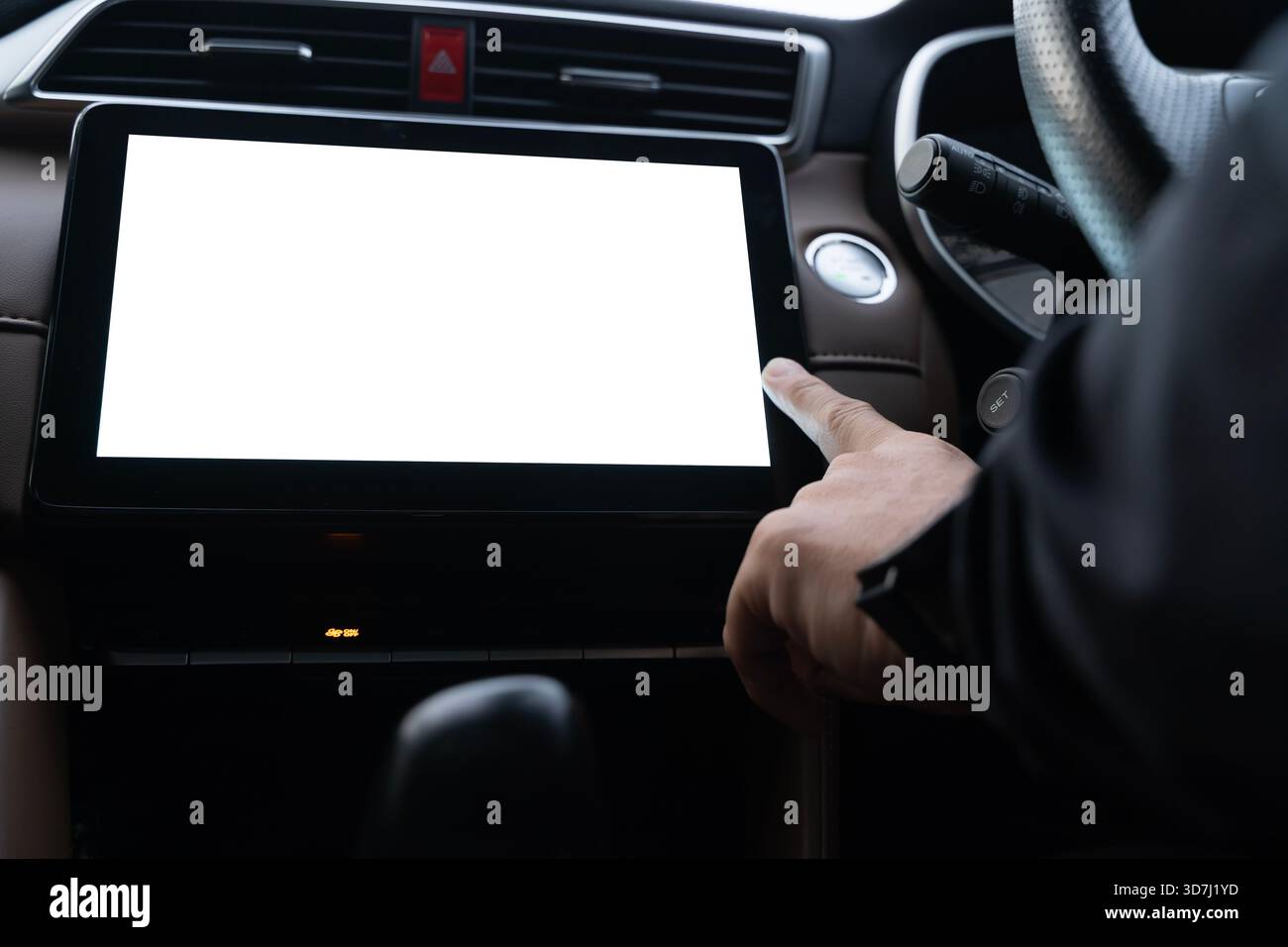 Touch Inside Close-up shot of a driver touching a blank touchscreen display inside a ...