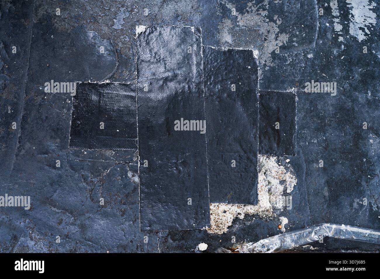 Black grunge wall texture with black cloth tape Stock Photo