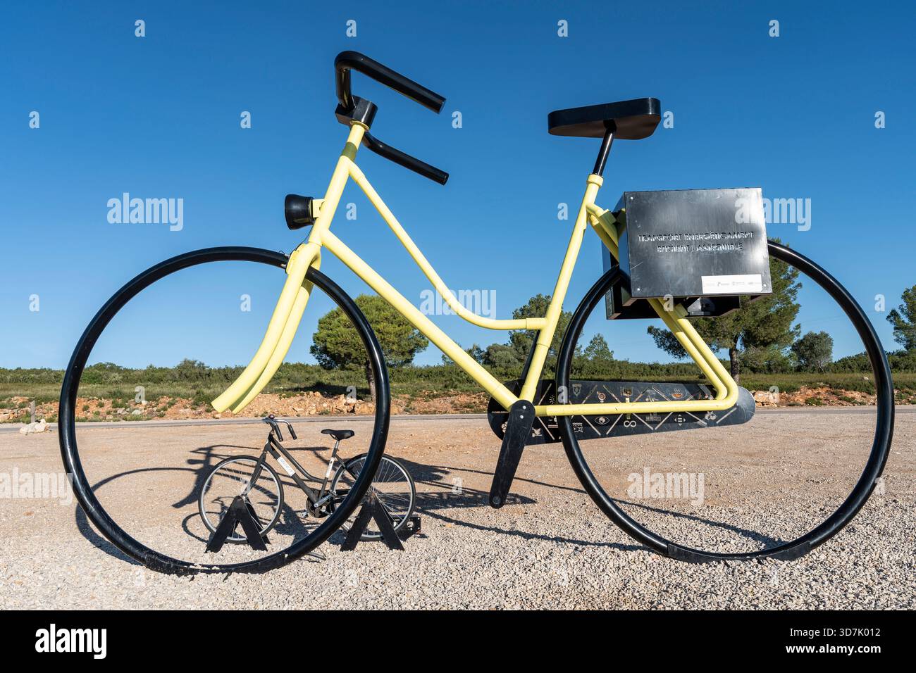 giant bicycles support Giant bicycle sculpture in support of affordable energy and sustainable  development, Vall d'Alba, park of ancient olive trees, Valencian Community,  Spain Stock Photo