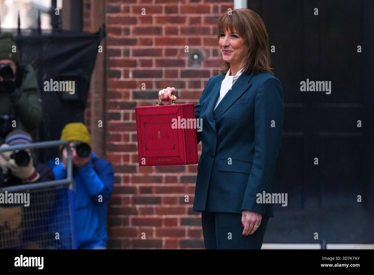 Rachel Reeves Folder Britain's Chancellor of the Exchequer, Rachel Reeves, holds up the ...