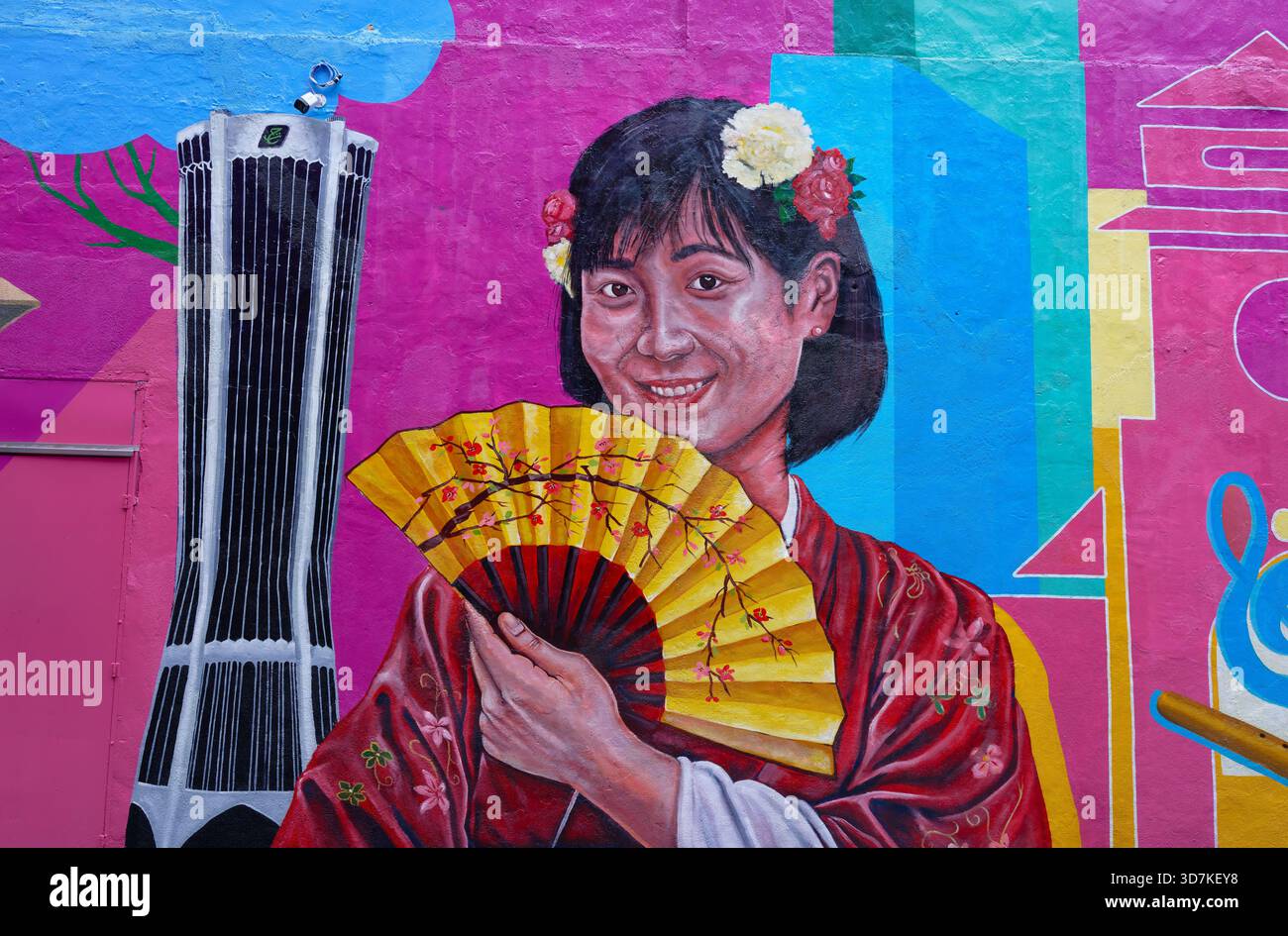 Girl with flower in hair and a fan, Street art murals in Pasar Karat, Chinatown, Kuala Lumpur Stock Photo