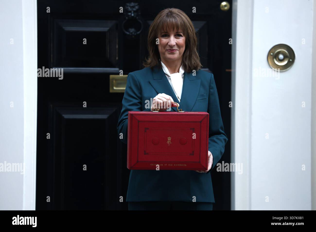 Chancellor of the Exchequer, Rachel Reeves, poses with the red Budget ...