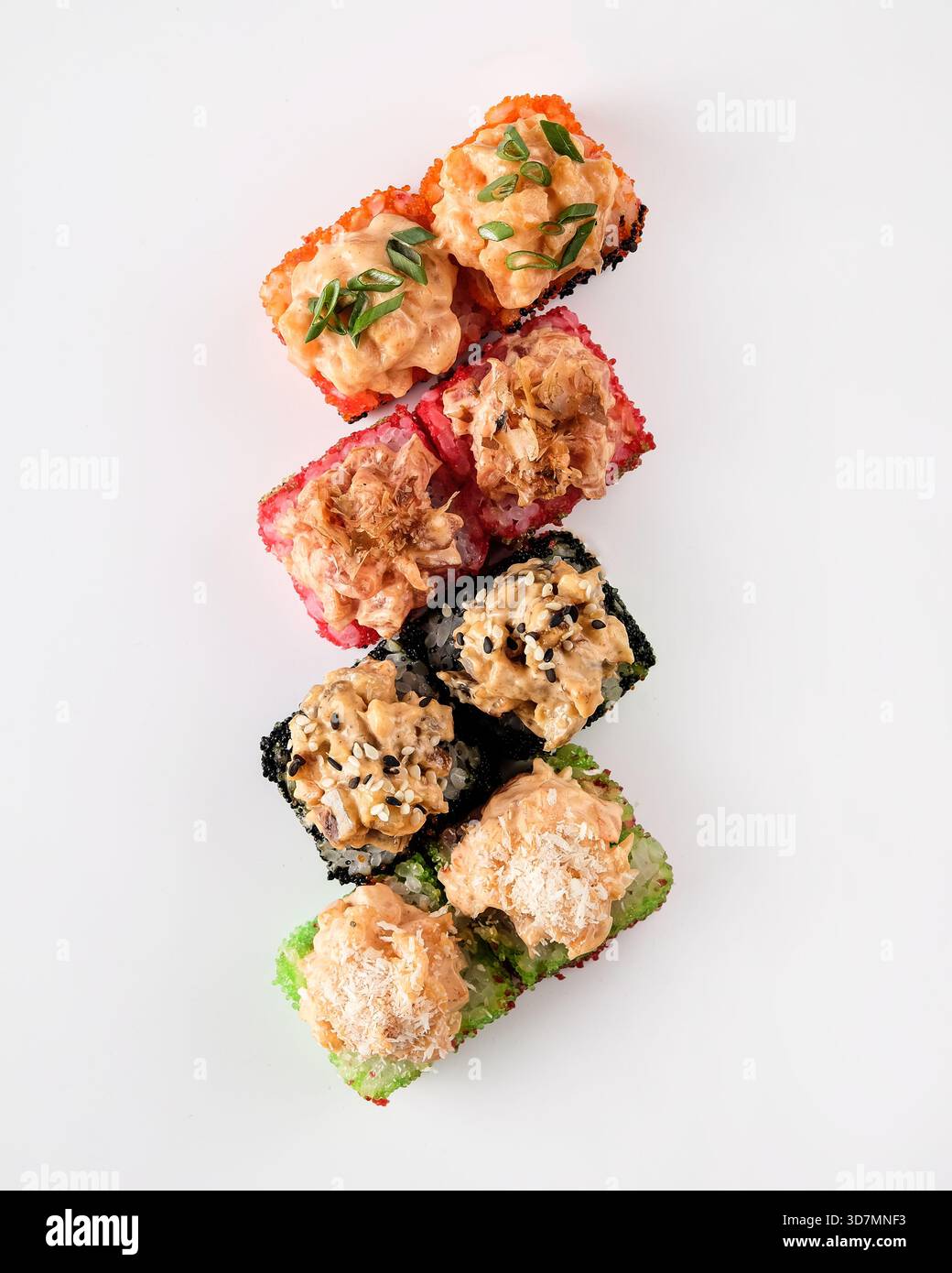 Stacked sushi towers with colorful toppings, vertical composition ...
