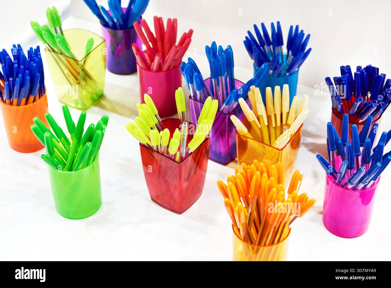 Modern colored plastic ballpoint pens on store display Stock Photo