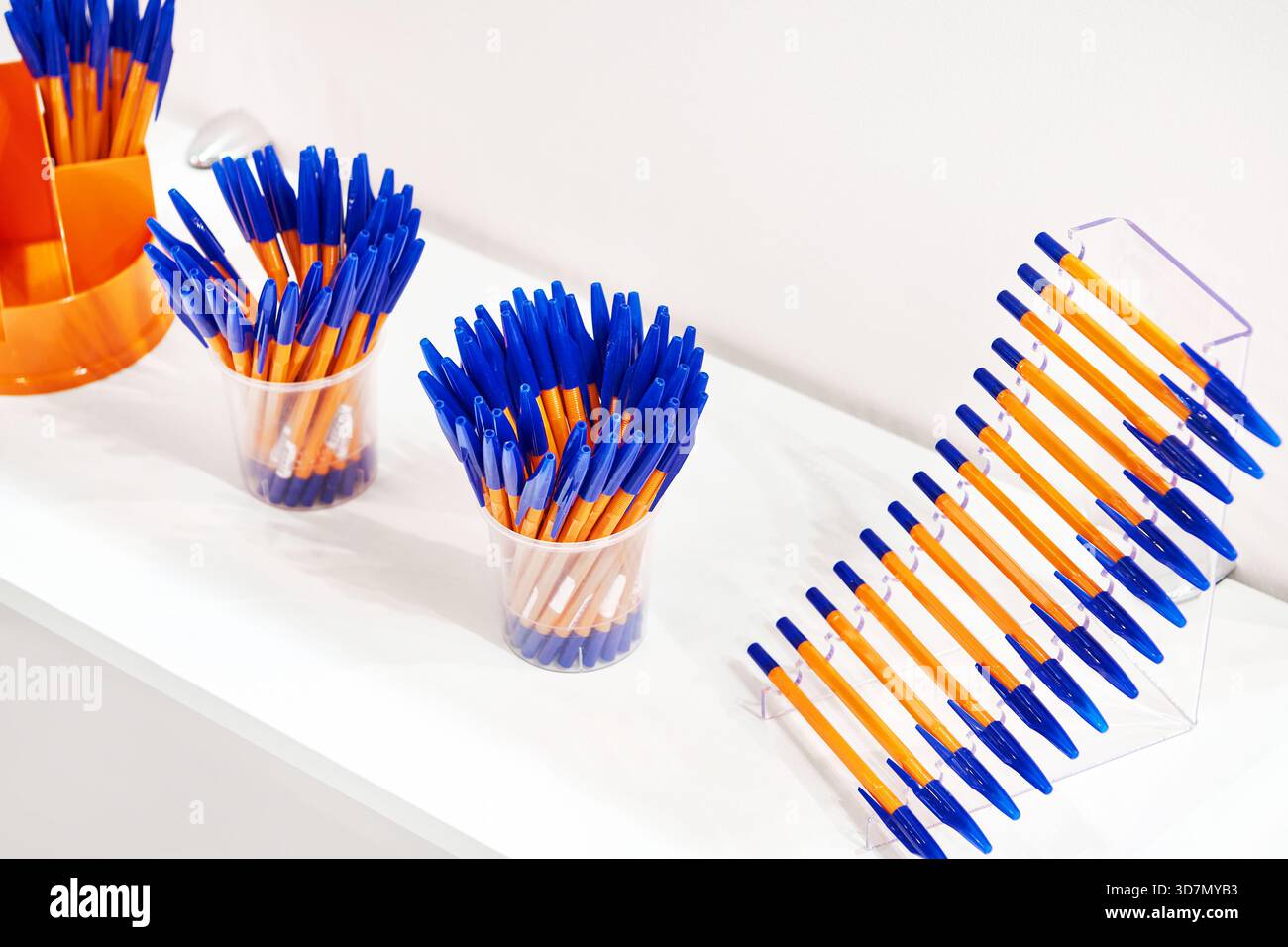 Modern colored plastic ballpoint pens on store display Stock Photo