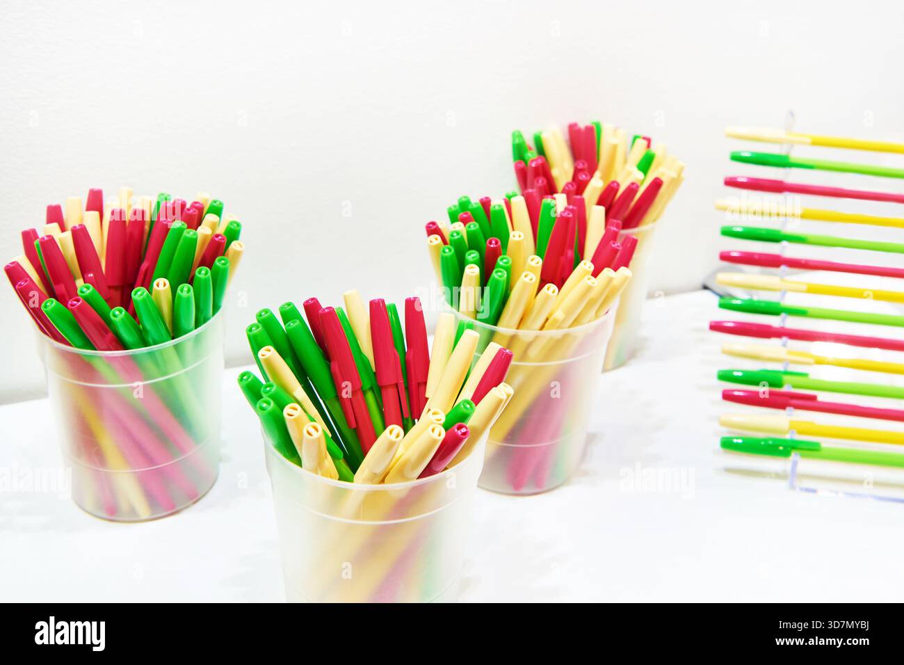 Modern colored plastic ballpoint pens on store display Stock Photo