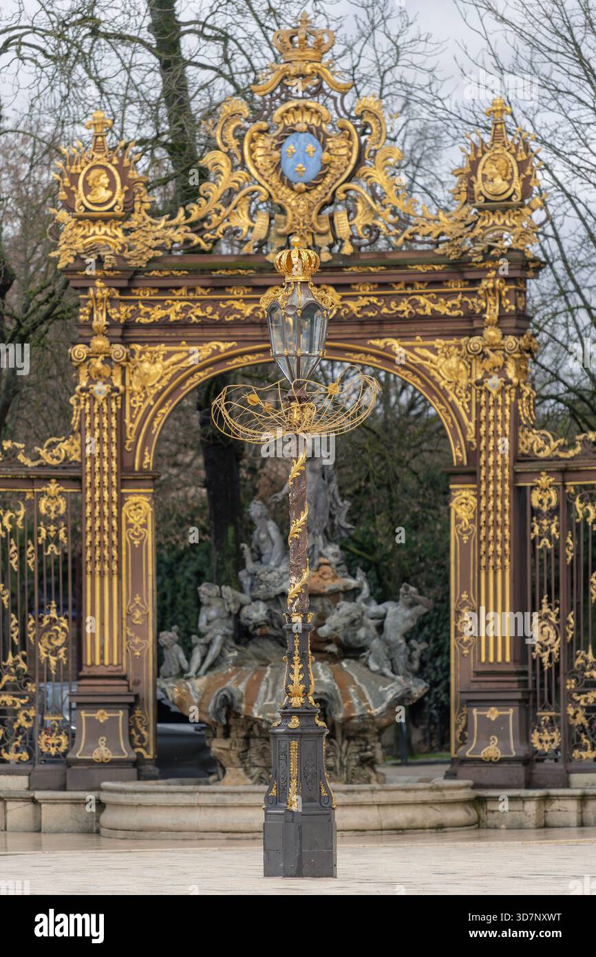 Nancy, France - View of Place Stanislas with the railings of the Amphitrite  Fountain made by Jean Lamour in iron and gilded with gold leaf Stock Photo  - Alamy, image size:866x1390