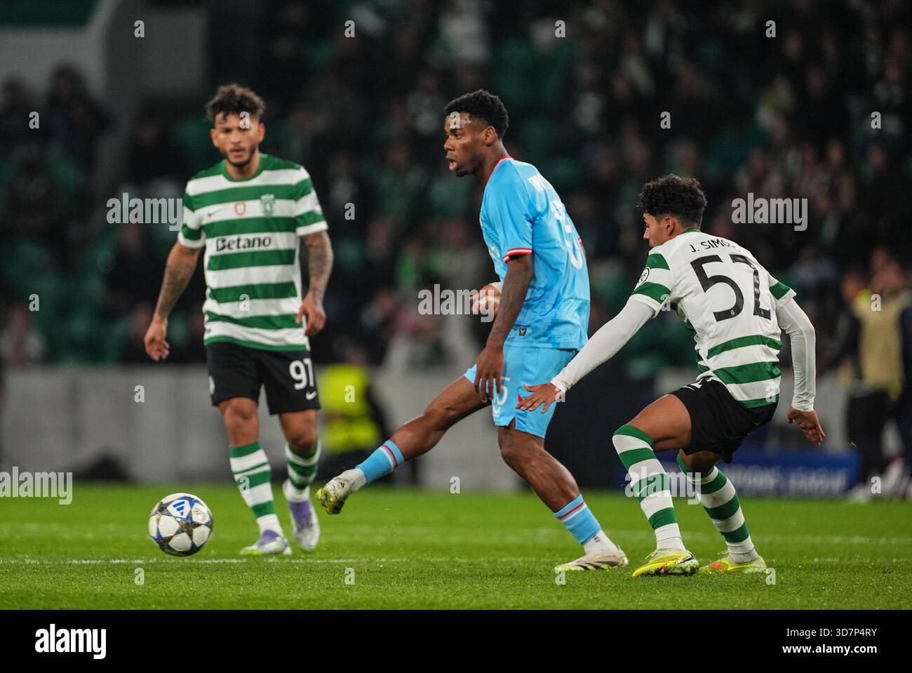 Club's Raphael Onyedika and Sporting's Joao Simoes fight for the ball ...