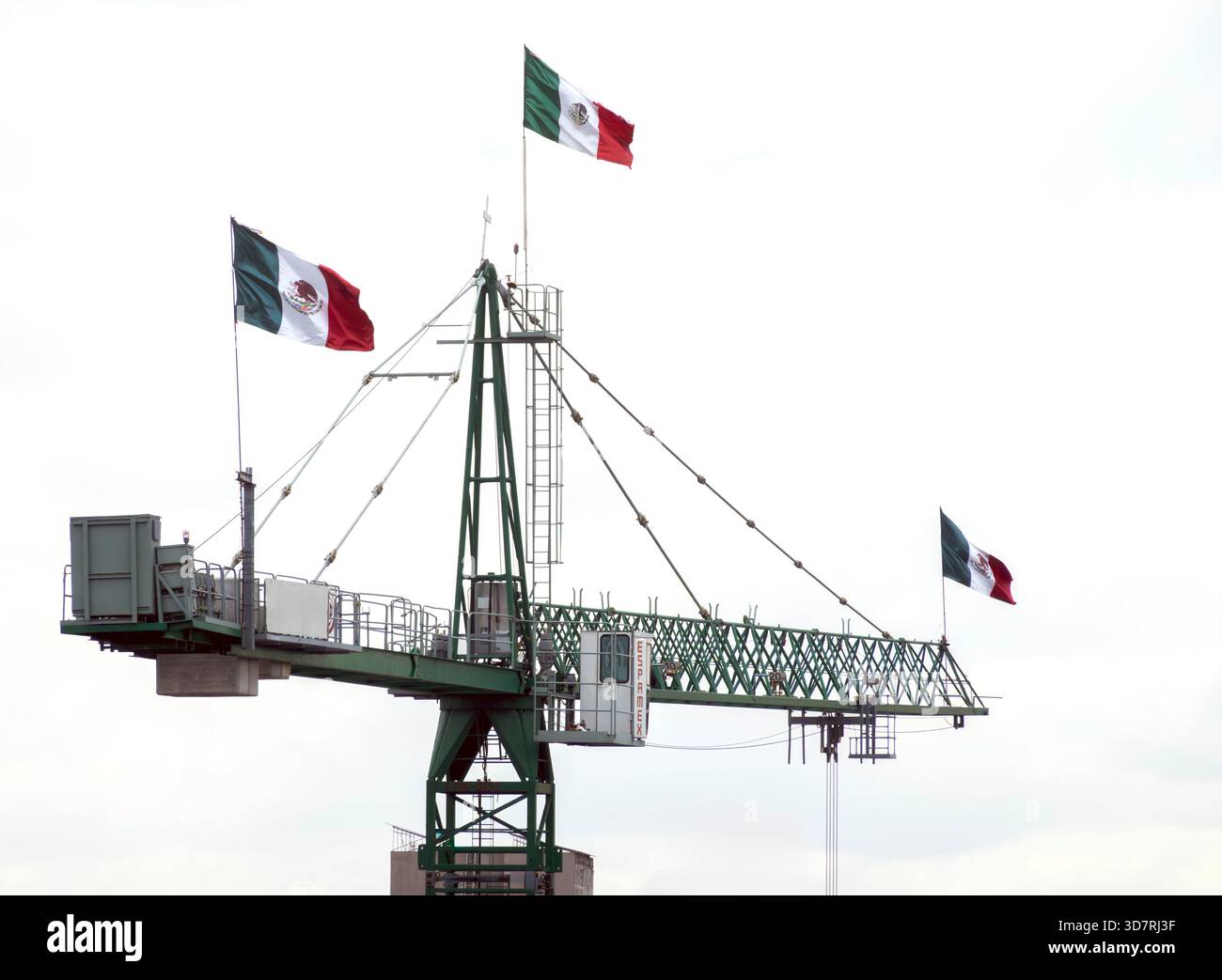 Mexican flags on a construction crane Stock Photo