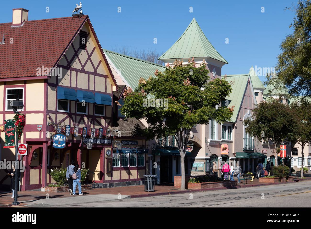 Danish-style storefronts and tourists on a sunny day in Solvang, California Stock Photo