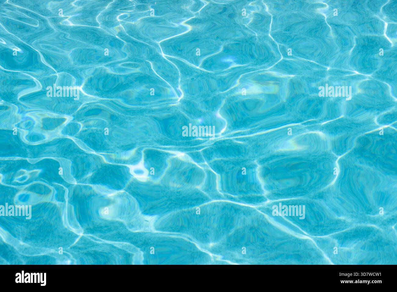 Light blue water reflecting sunlight in swimming pool Stock Photo