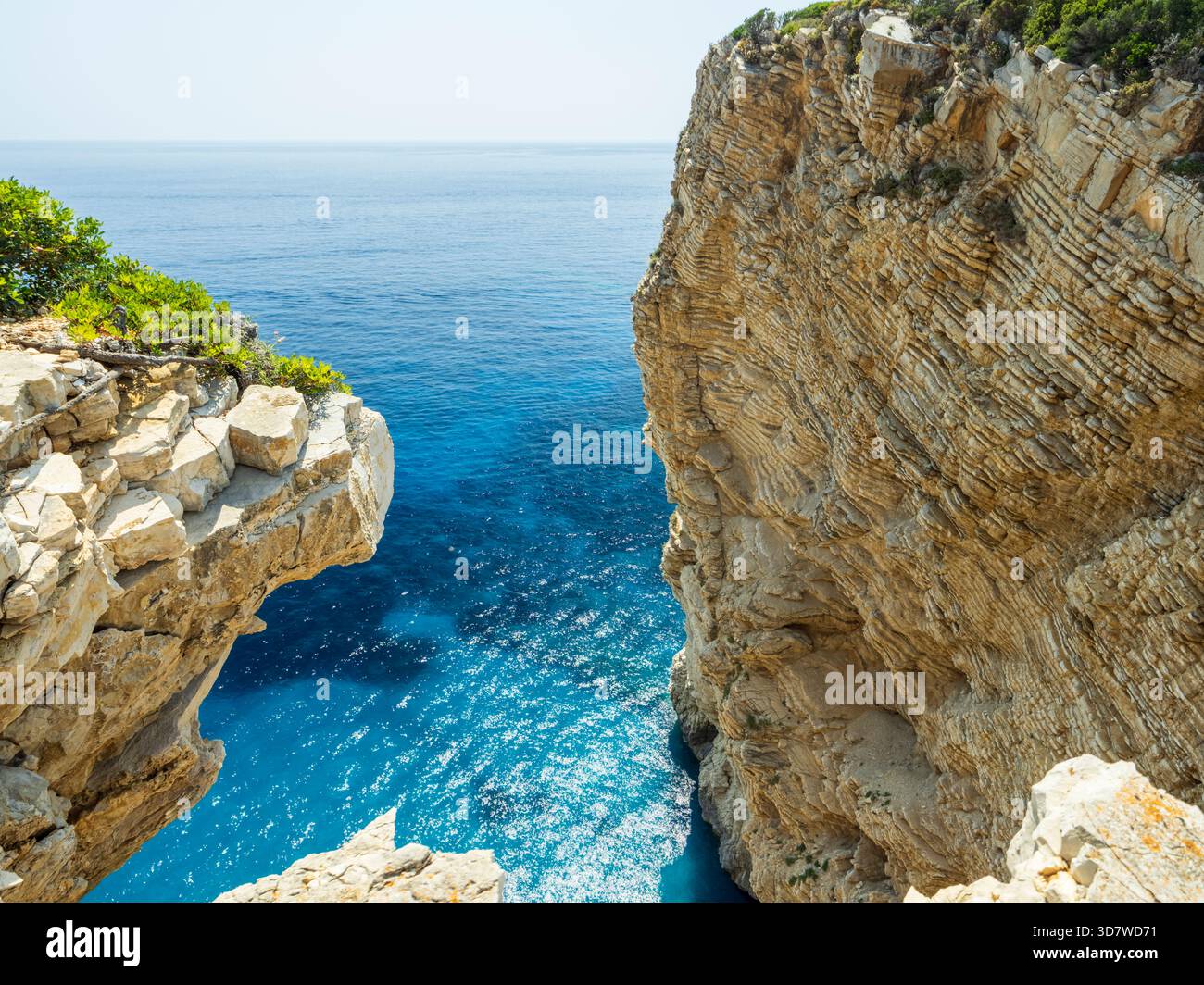 Blue water cliffs calm sea hi-res stock photography and images - Alamy