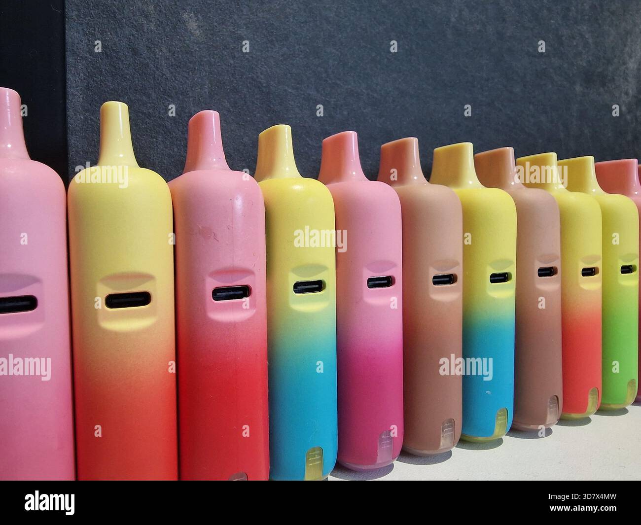 Generic vapes, e-cigarettes. Concept background for concern over health,  cancer, plastic use, environment, habit, youth, smoking, vaping. Refillable  Stock Photo