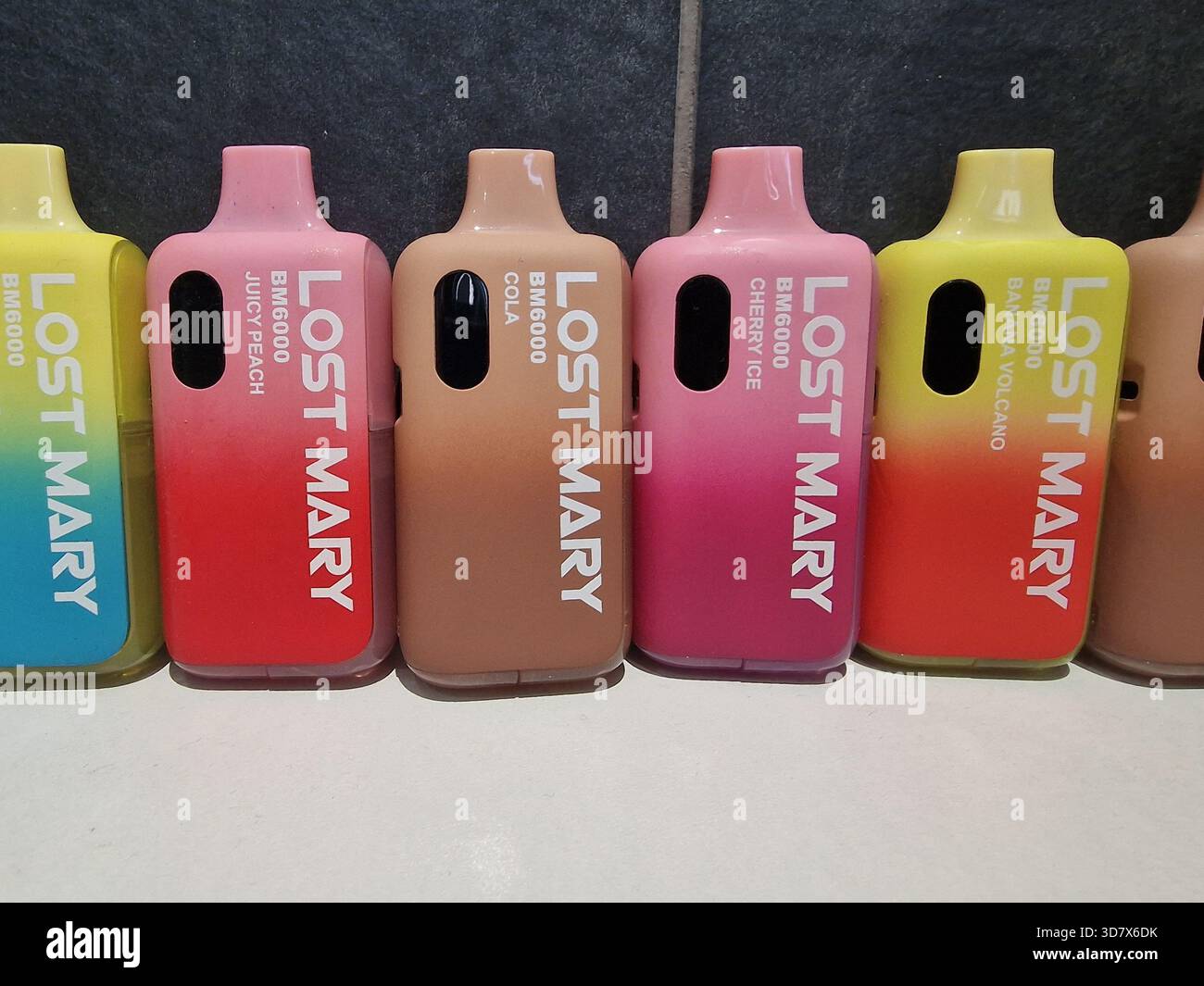 Durham, UK - 27 November 2025: Lost Mary Vapes BM6000. Re-fillable vape  with disposal vapes in the background. Vaper, smoking, habit, plastic  concern Stock Photo - Alamy