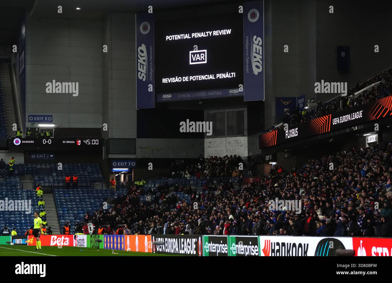 A notice on the big screen of a VAR penalty review during the UEFA ...