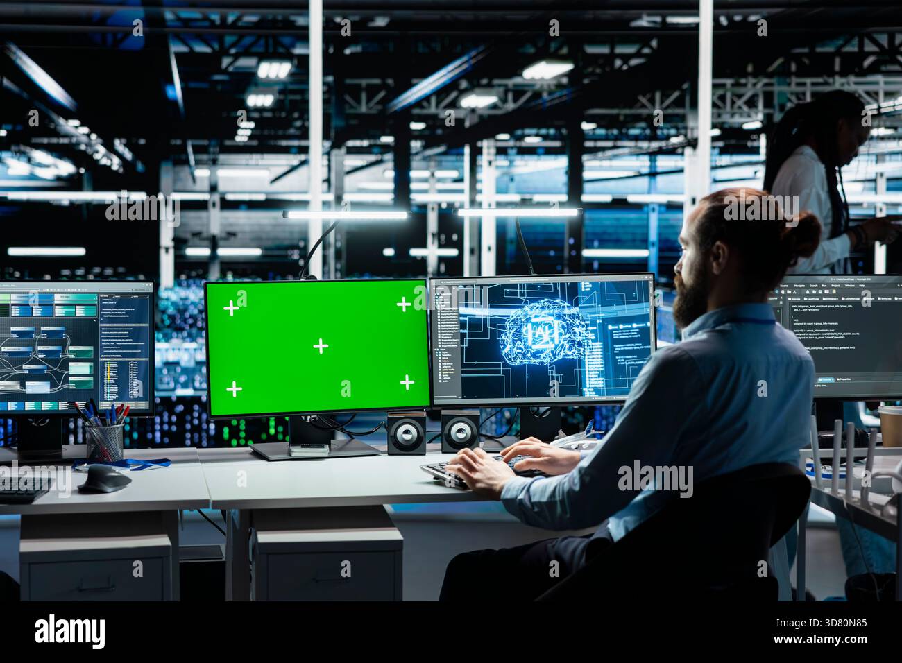 Developer in data center using isolated screen PC, optimizing gear for AI tasks, increasing workloads. Server room IT worker automating system diagnostics using deep learning on chroma key computer Stock Photo