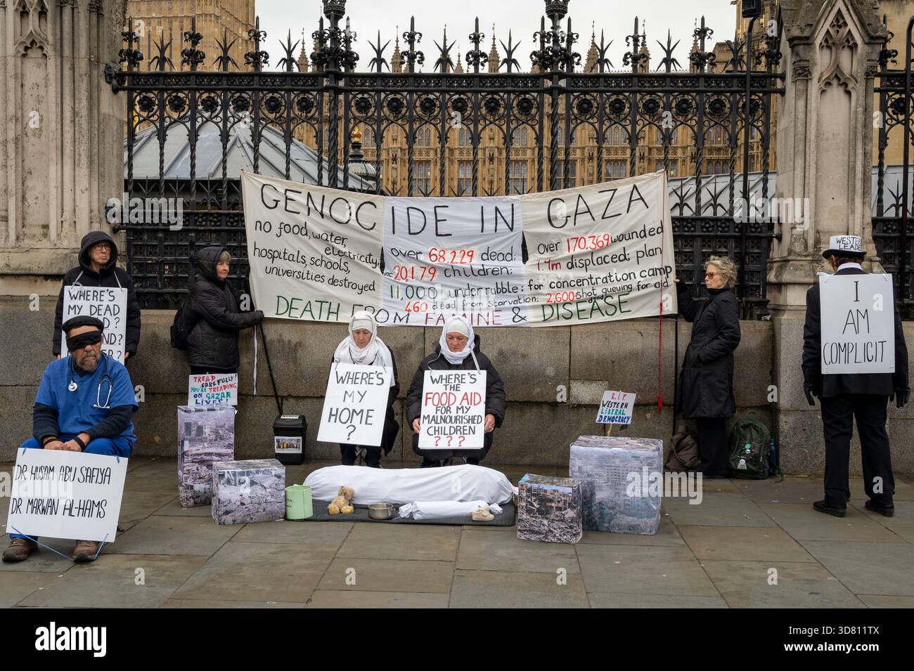 Protesters in front of Parliament, London, highlighting the genocide in Gaza and supporting those in medical need and medical staff in Israeli jails. Stock Photo