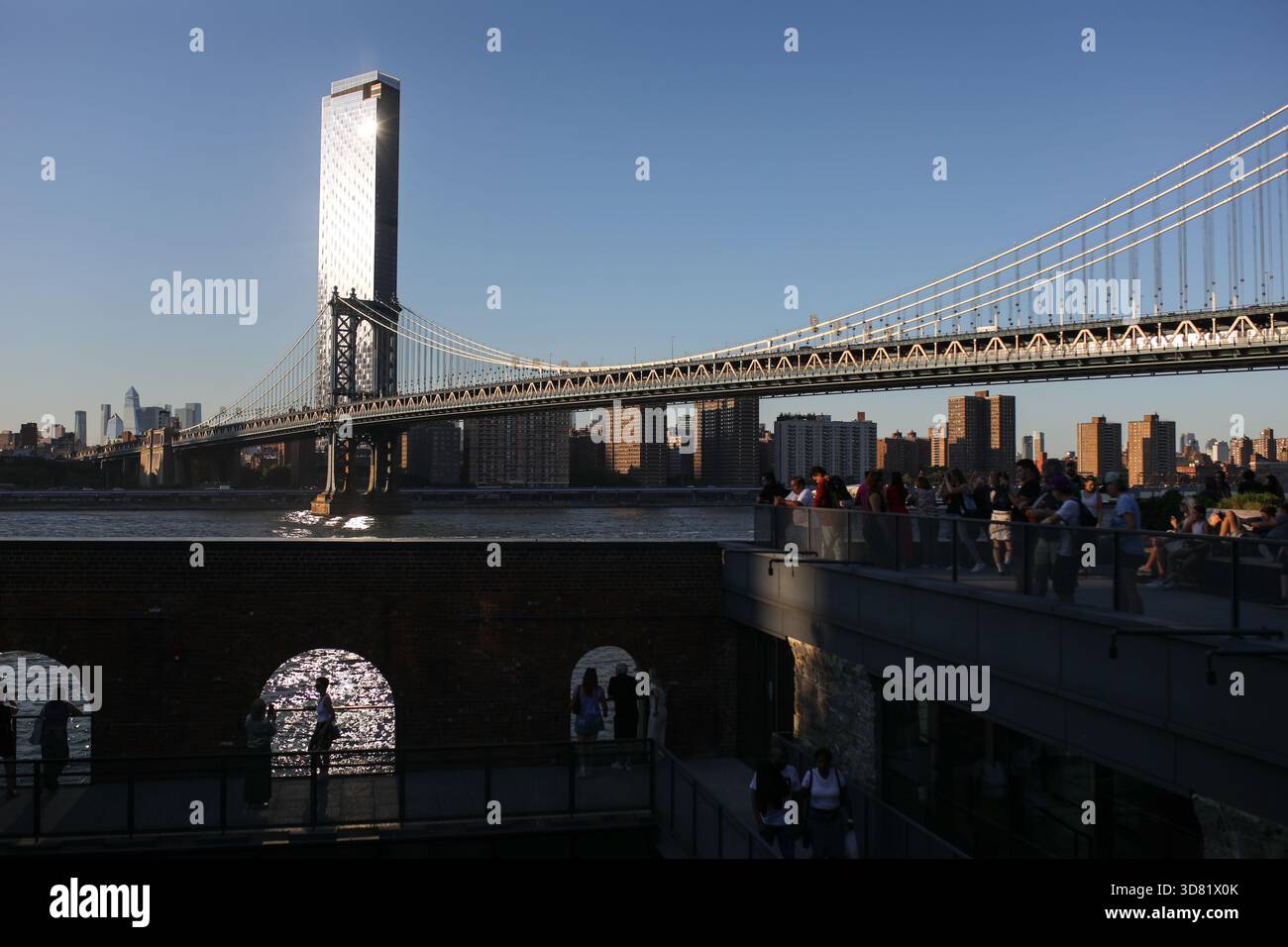 Tourists are watching the sunset from Time Out Market's rooftop, in ...