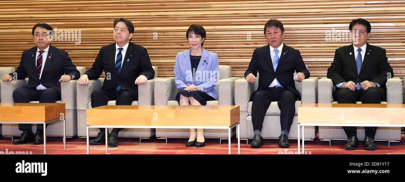 Japanese Prime Minister Sanae Takaichi (center) attends a cabinet ...