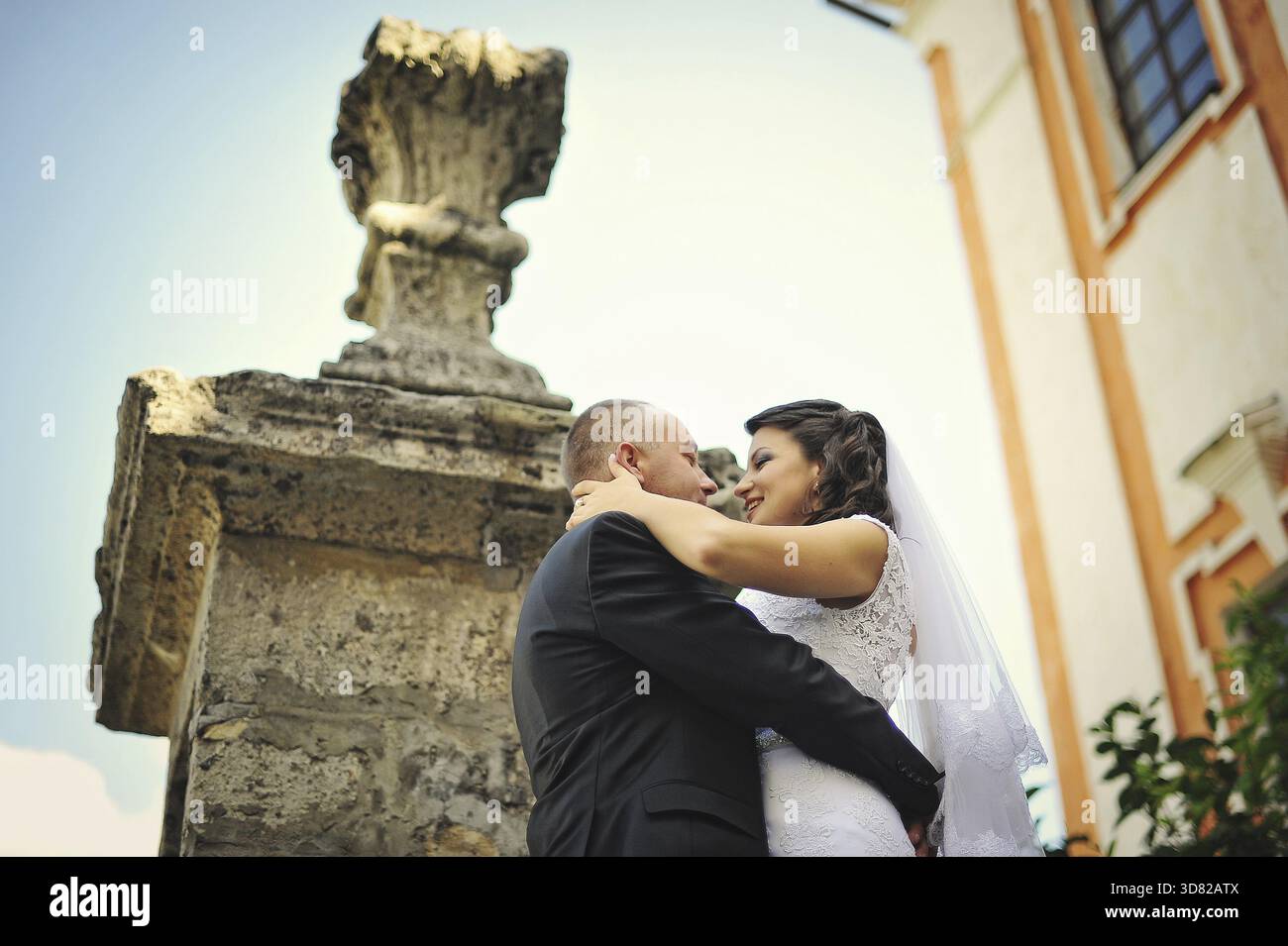Wedding adult couple in the courtyard of castle Stock Photo - Alamy